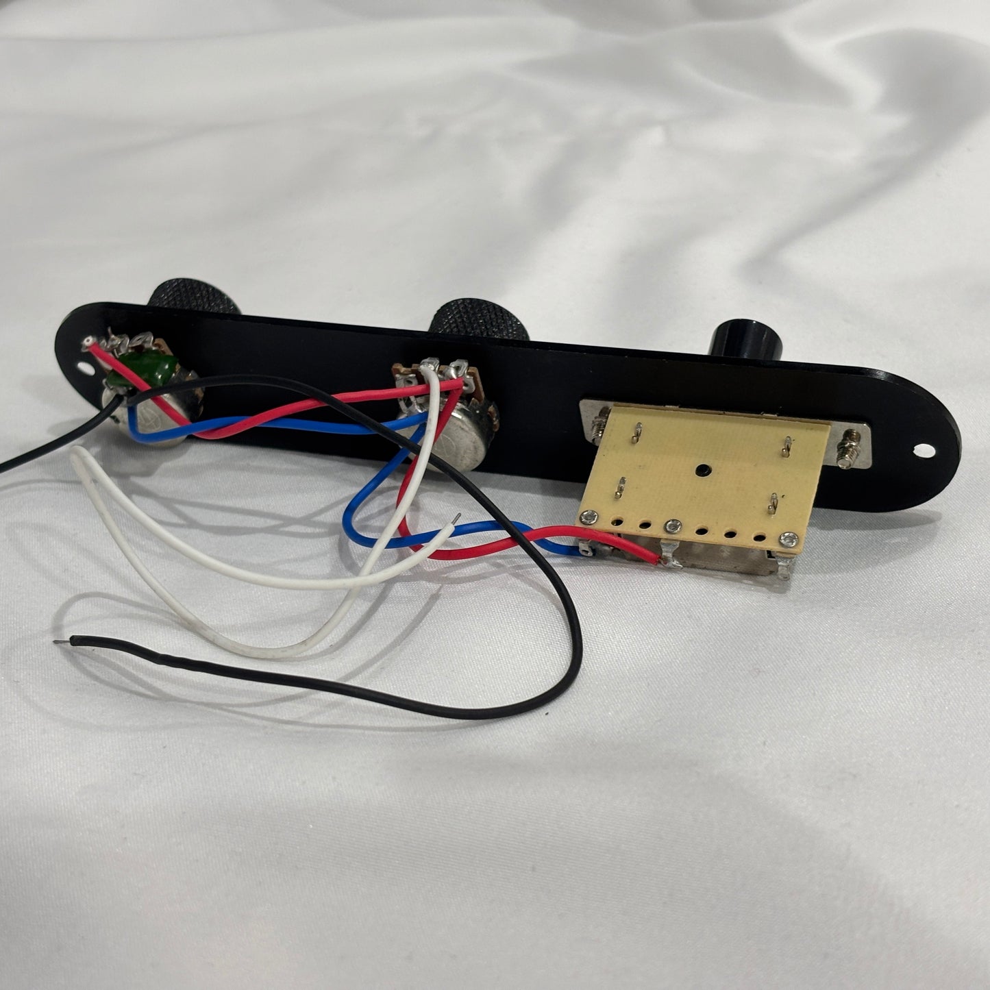 Black loaded TL-style Control Plate against a white background.
