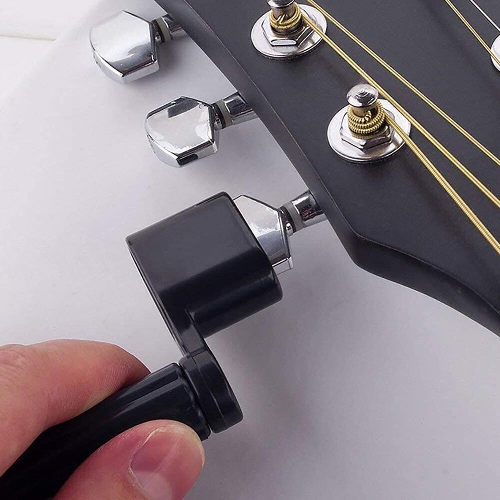 A Black Guitar String Winder being used on an Electric Guitar.