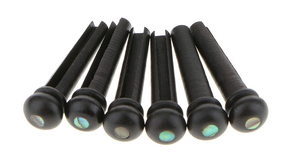 Six Ebony Acoustic Guitar Bridge Pins with Abalone dots against a white background.