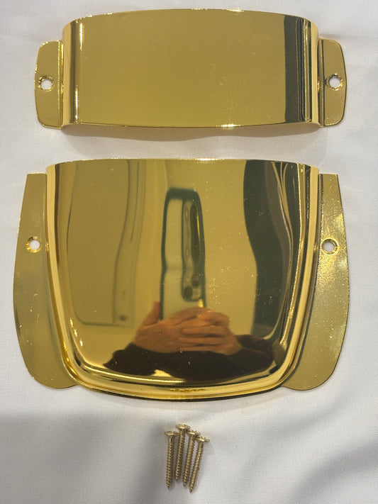 Gold Bass Guitar Bridge and Pickup Covers on a White background.
