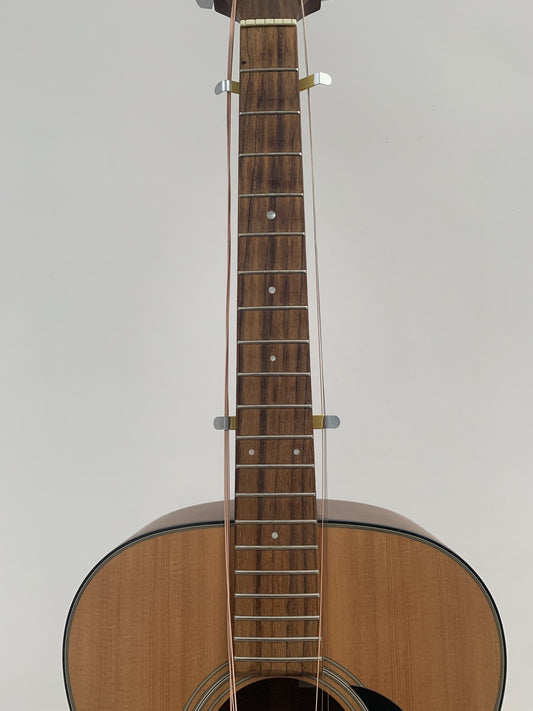 Front view of a guitar's neck with a pair of String Spreaders attached.