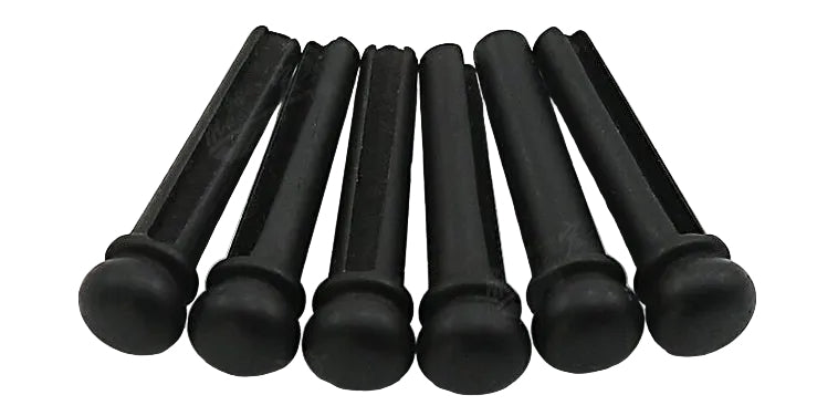 Set of Ebony Guitar Bridge Pins on a white background