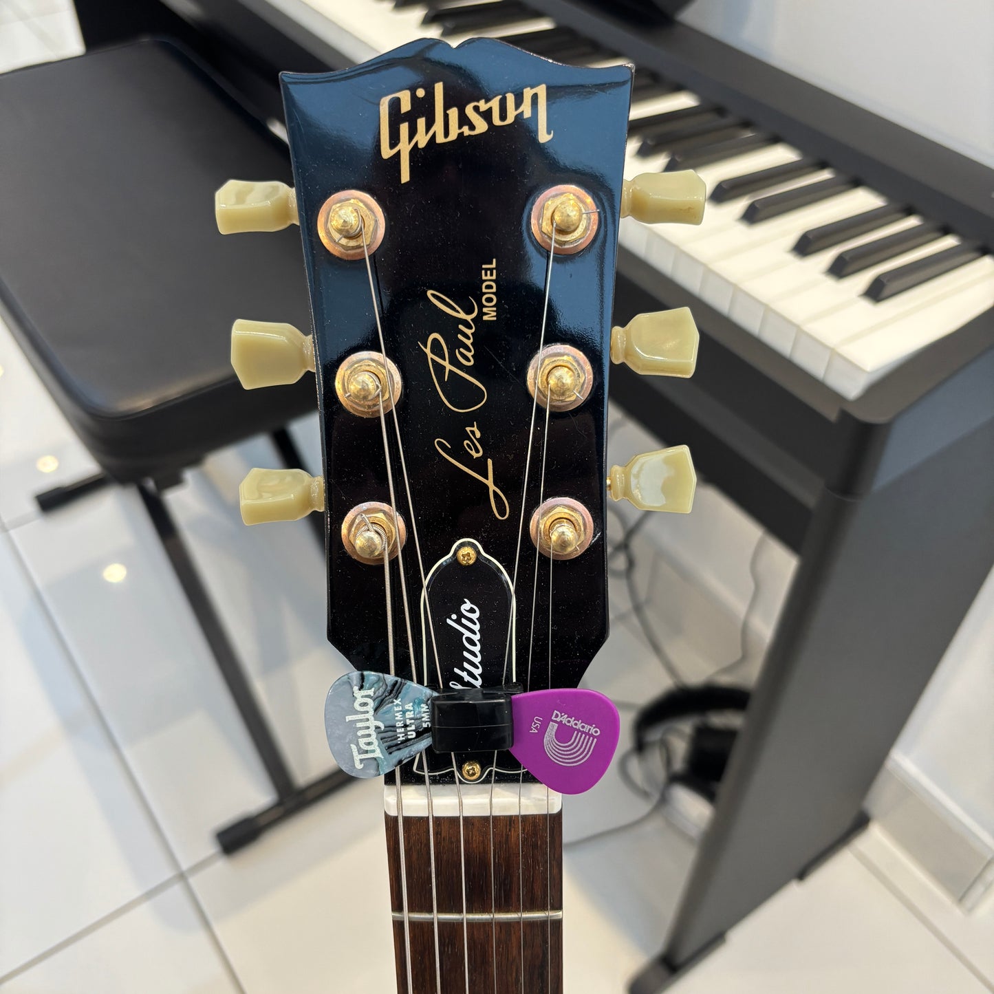 Guitar Headstock Pick Holder - Black Rubber, Holds 2-6 Picks, Fits Between Nut & Capstan | Guitars Limited