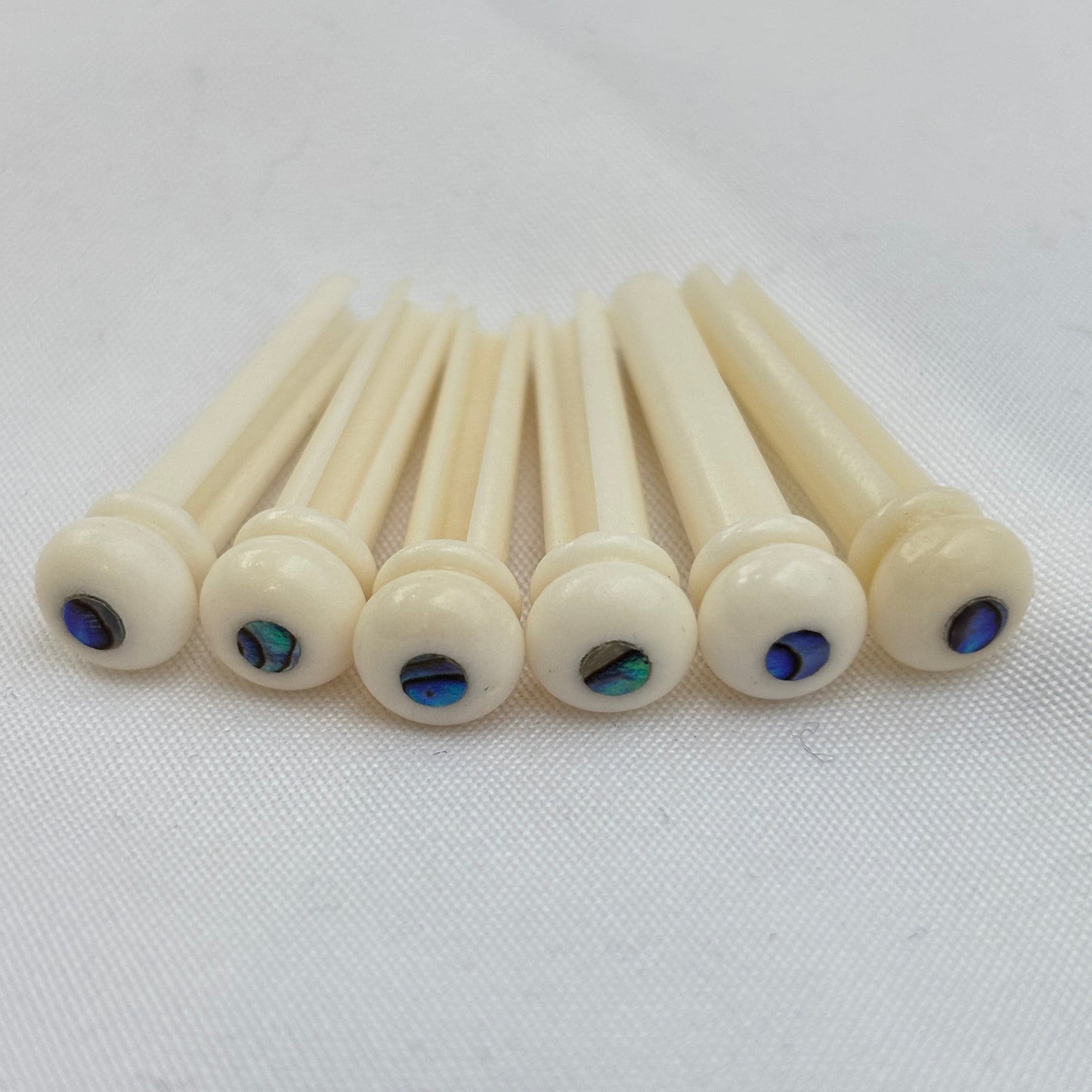 Bleached Bone Acoustic Guitar Bridge Pins with Abalone Inlays | Guitars Limited