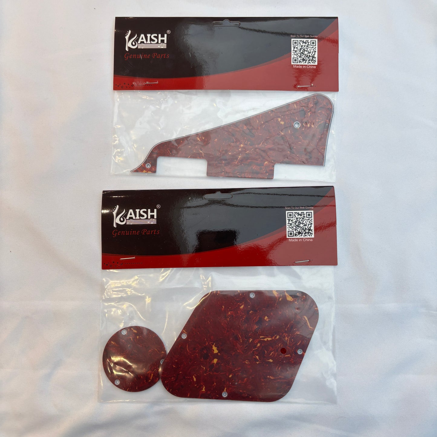Red tortoiseshell electric guitar pickguard set, LP-compatible, on a white background.