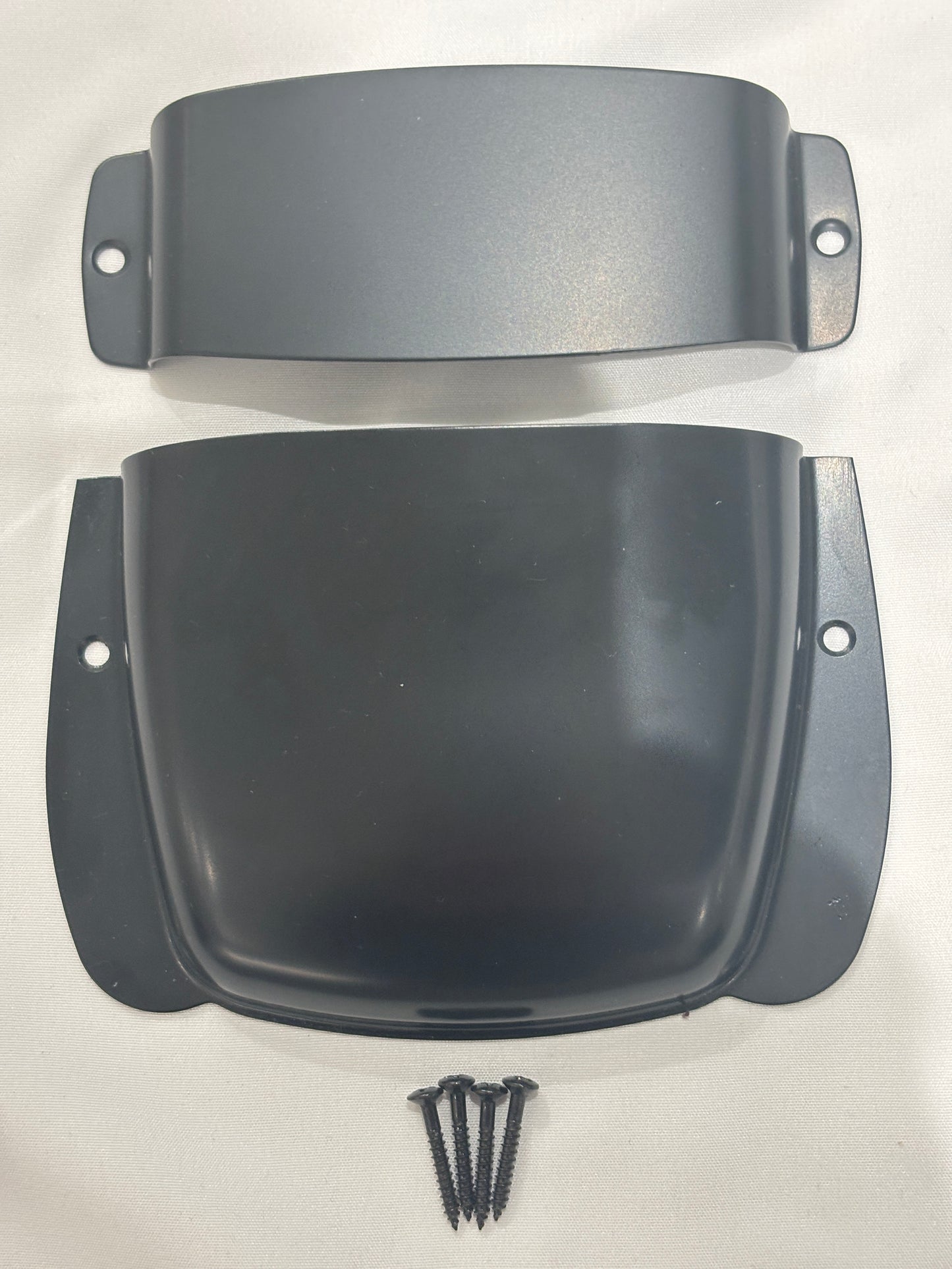 Black Bass Guitar Bridge and Pickup Covers on a White background.