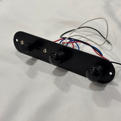 Black loaded  TL-style Control Plate against a white background.