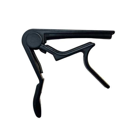 Black guitar capo on a white background