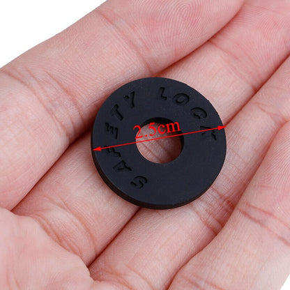 A Black Rubber Strap Lock photographed in a hand for scaling.