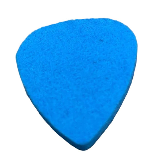 Blue felt guitar pick ('plectrum') on a textured grey surface.
