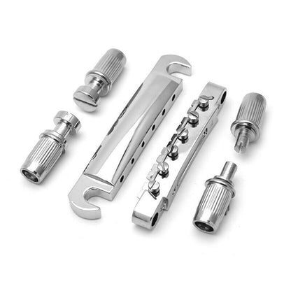 Electric Guitar bridge kit LP-style in chrome against a white background.