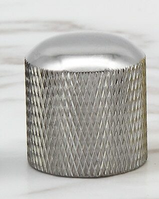 Chrome electric guitar control knob on a white background.