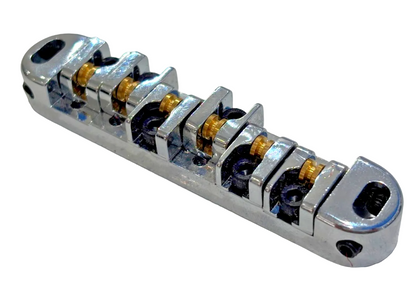 Chrome electric guitar roller bridge on a white background.
