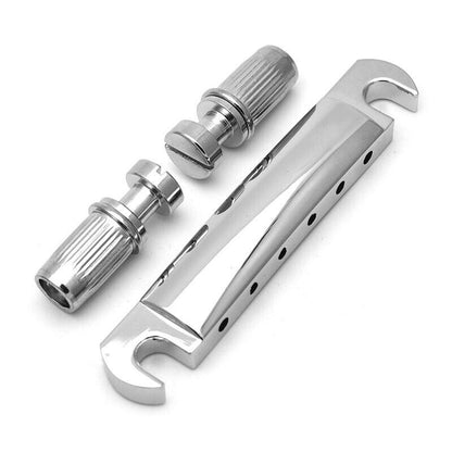 Electric guitar tailbar with supports in chrome colour on a white background.