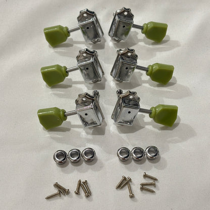 Set of chrome Keystone guitar tuners / machine heads with green buttons on a white background