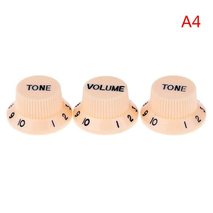 Three Cream electric guitar Control Knobs labeled 'TONE' and 'VOLUME', ST-style, in Black text on a white background.