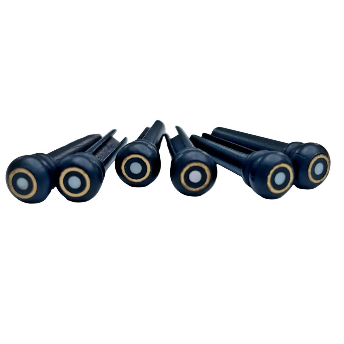 Six Ebony Guitar Bridge Pins with a brass ing and a Mother of Pearl dot on a light background.