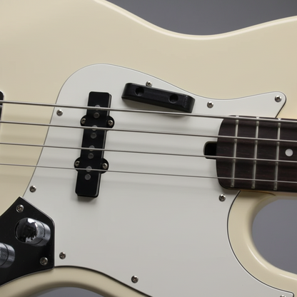 Close-up of a White Electric Bass Guitar showing possible Thumb Rest ('Tug Bar') positioning  on a grey background.