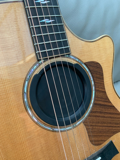A Feedback Buster / Suppressor fitted to a high-end acoustic guitar in a lounge.