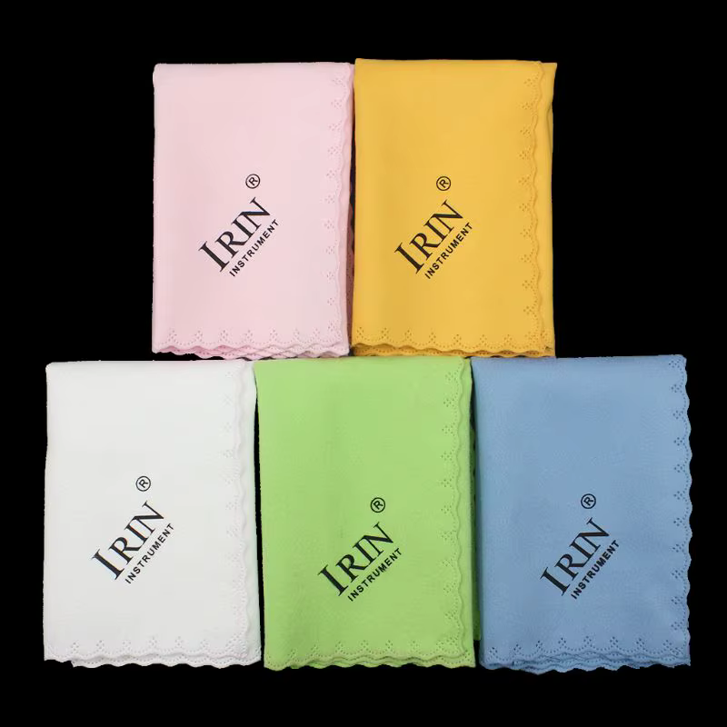 Five colourful Guitar Cleaning cloths with 'IRIN' branding photographed laid flat on a black background.