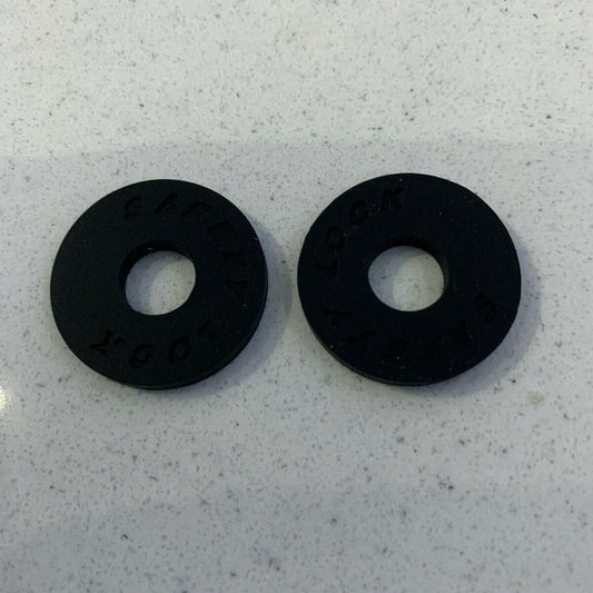 Two Black Rubber Guitar Strap Locks on a light grey background.