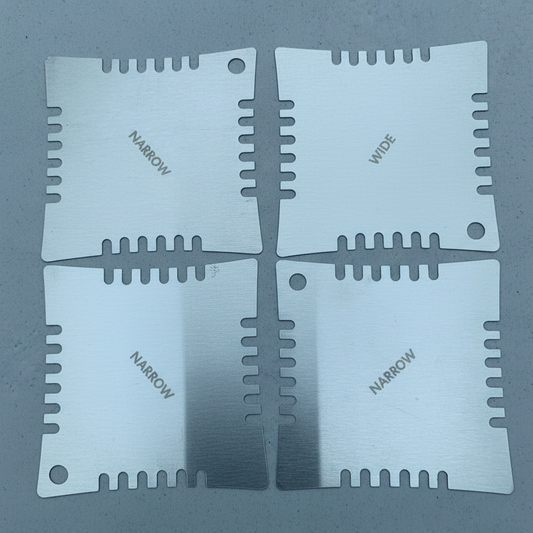 The front of Four Guitar Notched Radius Gauges photographed on a  grey background