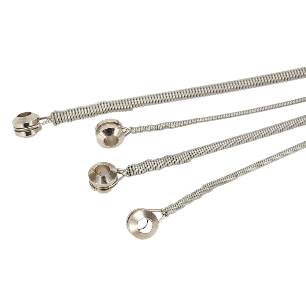 Four Bass Guitar String showing Ball Ends against a white background.