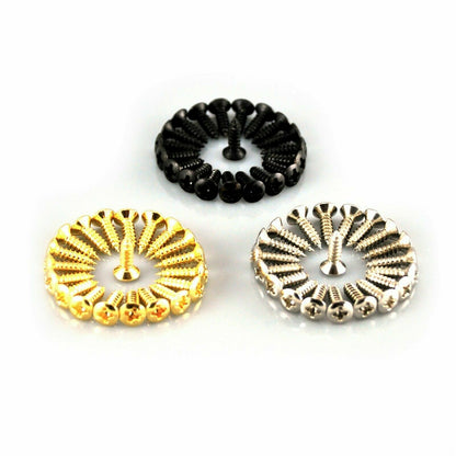 Gold, Black and Chrome Guitar Pickguard Screws on a white surface.