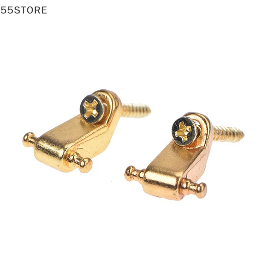 Two Gold Guitar String Trees on a white background