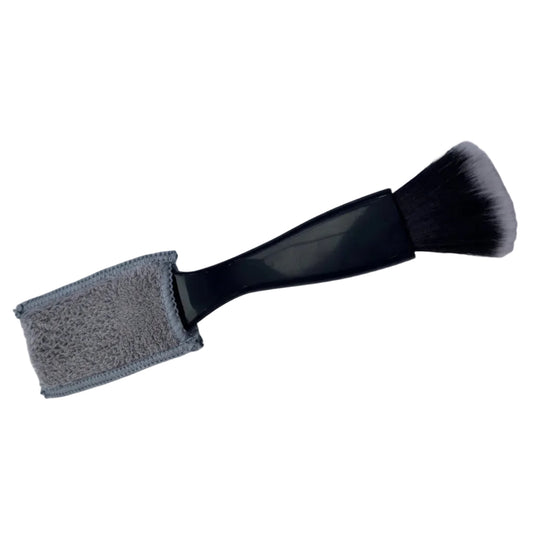 Guitar cleaning brush with foam pad on a light grey background.