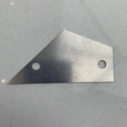 Guitar Fret Rocker photographed flat on a grey surface.