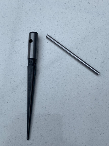 Guitar Hole Reamer showing its handle separated from its body against a grey background.