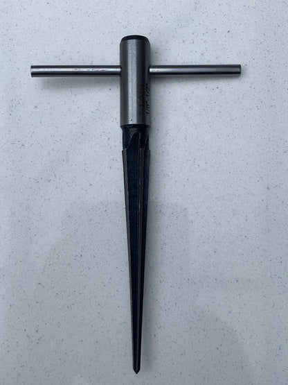 Guitar Hole Reamer against a grey background.