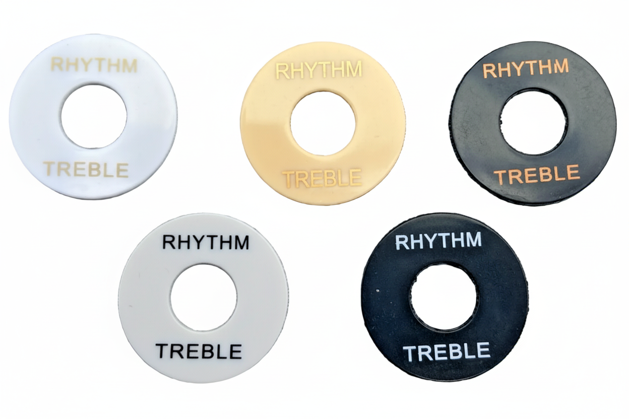 Five Guitar Toggle Switch / Pick Up Selector surround plates in different colours on a white background.