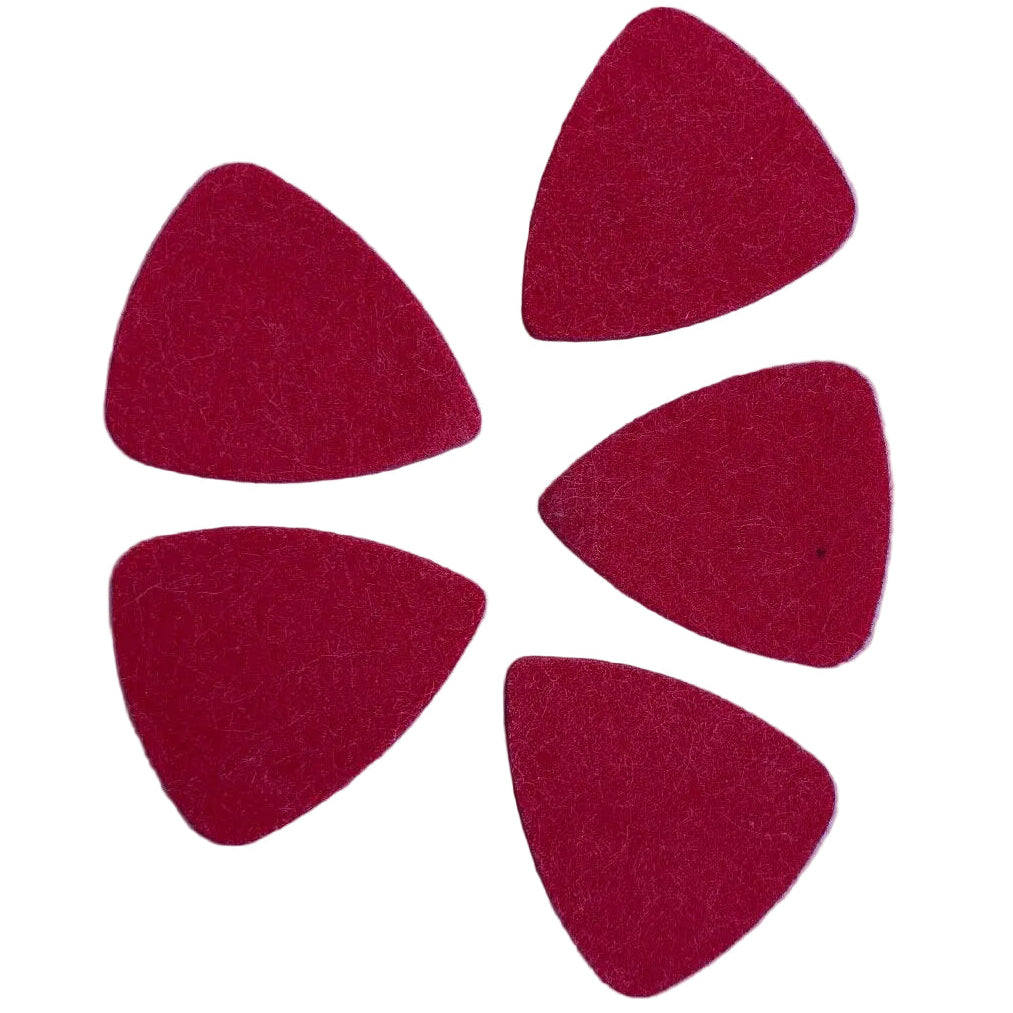 Five Red Felt Ukulele Plectrums / Picks photographed on a light grey surface.