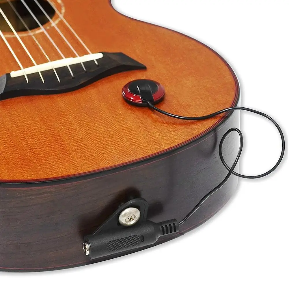 Acoustic guitar with a Red Piezo-Electric Pickup on a white background