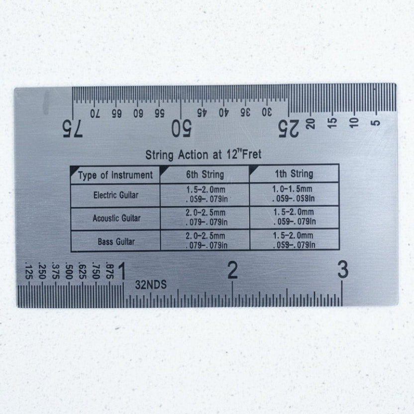 The back of a Steel Guitar Action gauge on a white background.