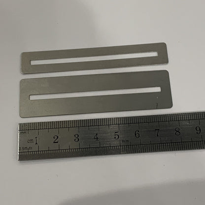 Two Guitar Fretboard Protectors/Guards photographed with a ruler for scale on a white background.