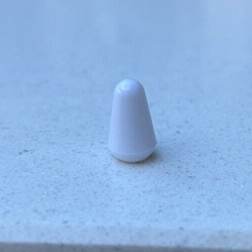 White electric guitar Toggle Switch Tip on a Grey background.