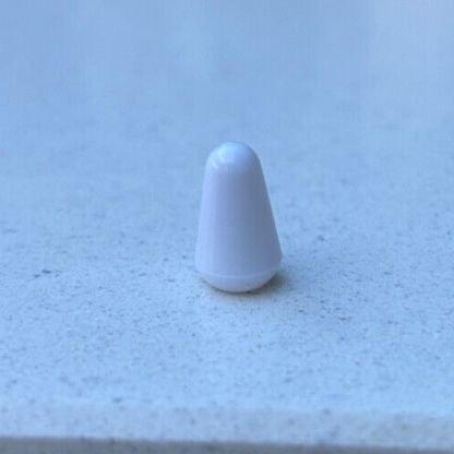 White electric guitar Toggle Switch Tip on a Grey background.