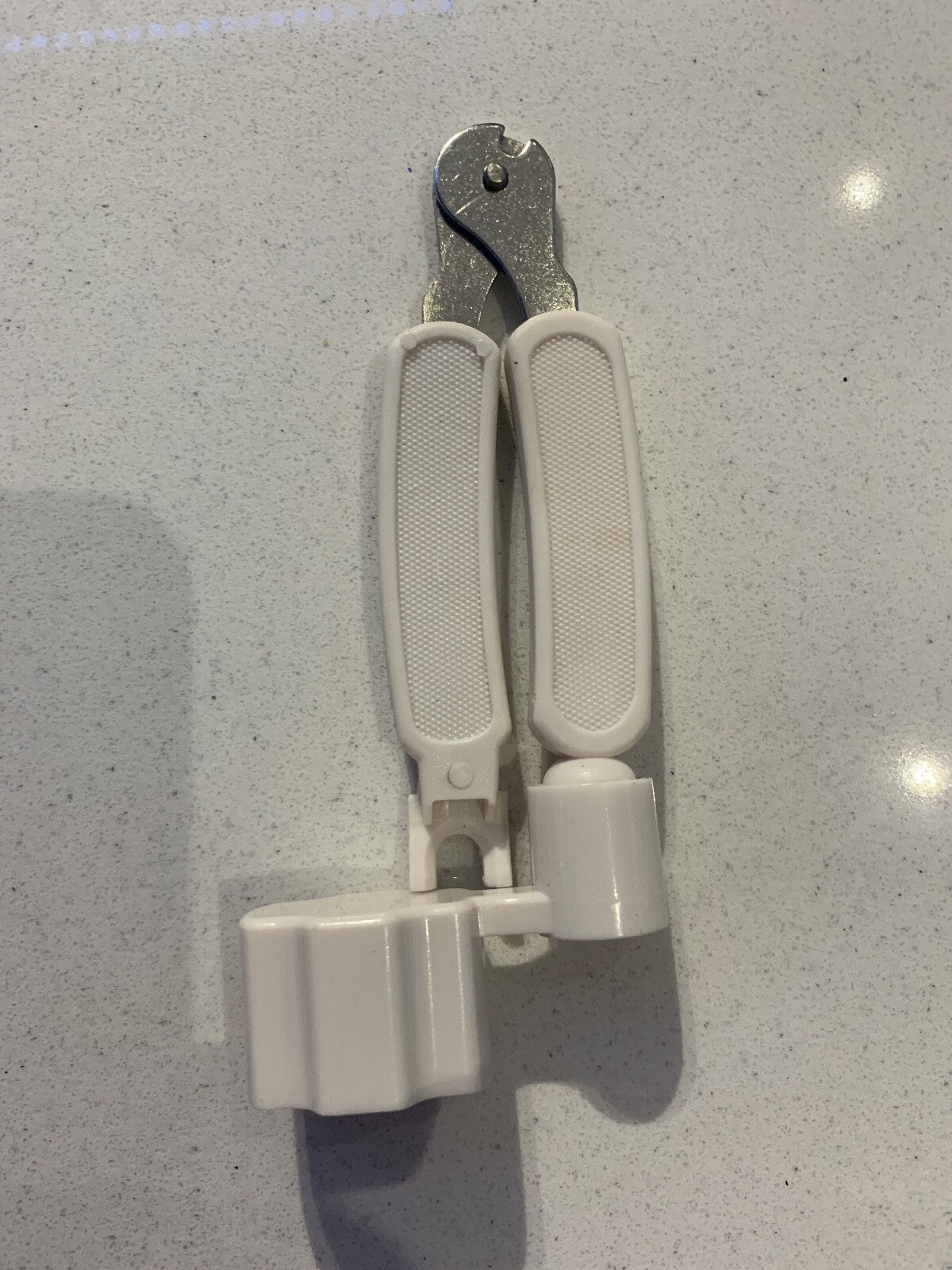 White Guitar Multi Tool against a light grey background.